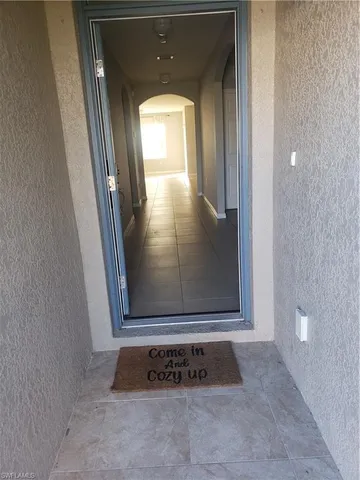 a kitchen with granite countertop a sink a stove and a microwave