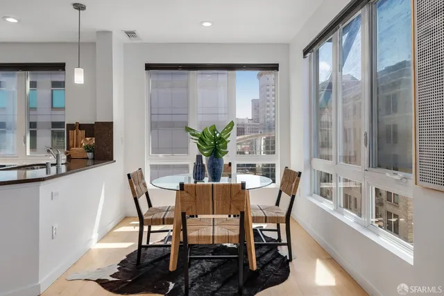 a kitchen with stainless steel appliances granite countertop a refrigerator a stove and a sink