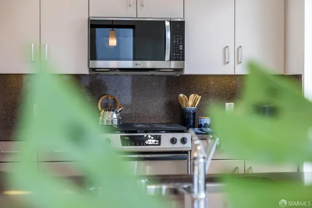 a living room with furniture and a mirror