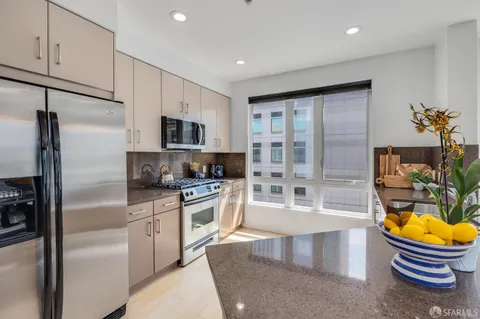 a bedroom with a bed and a potted plant