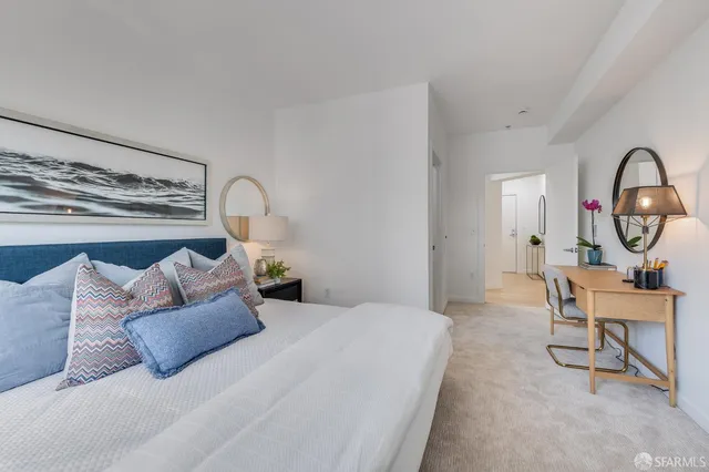 a bedroom with a bed and a chair