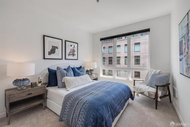 a view of a roof deck with table and chairs