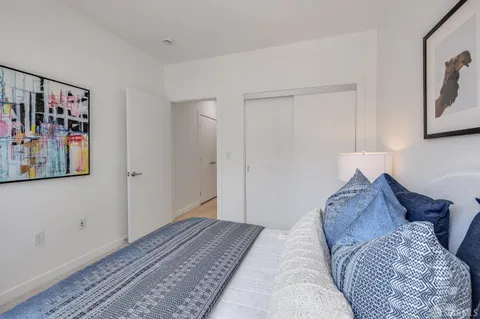 a view of a patio with a table chairs and a umbrella