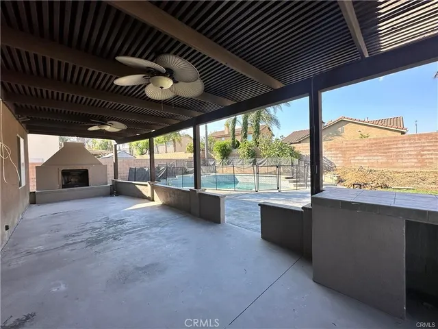 a view of living room with furniture and a large window