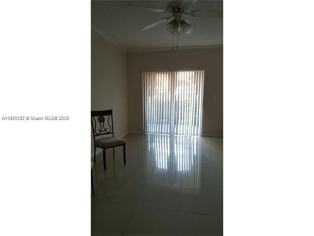 140 Southwest 117th Avenue, Unit 4101 Pembroke Pines, FL 33025 - Photo 3 of 8 a picture of a room with a window