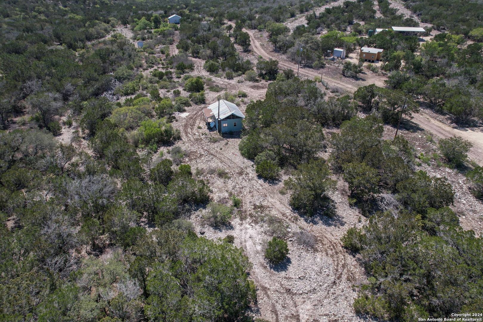 0 Rm 334 Brackettville, TX 78832 - Photo 4 of 15 an aerial view of house with yard and outdoor seating