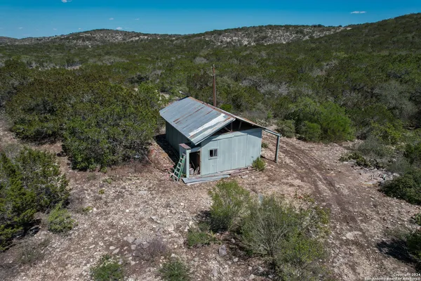 an aerial view of a house with mountain view