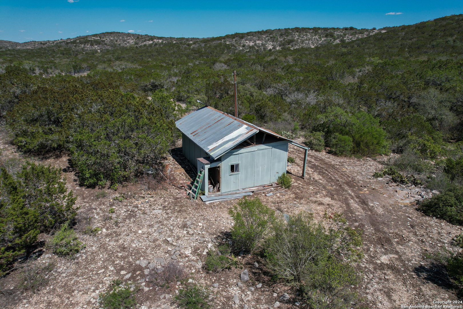 0 Rm 334 Brackettville, TX 78832 - Photo 6 of 15 an aerial view of a house with mountain view