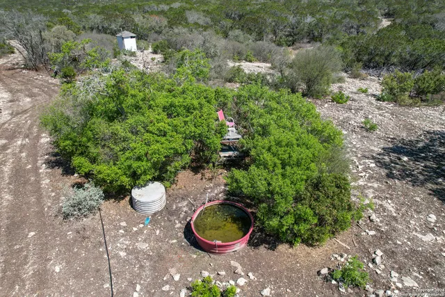a wooden fence with some trees