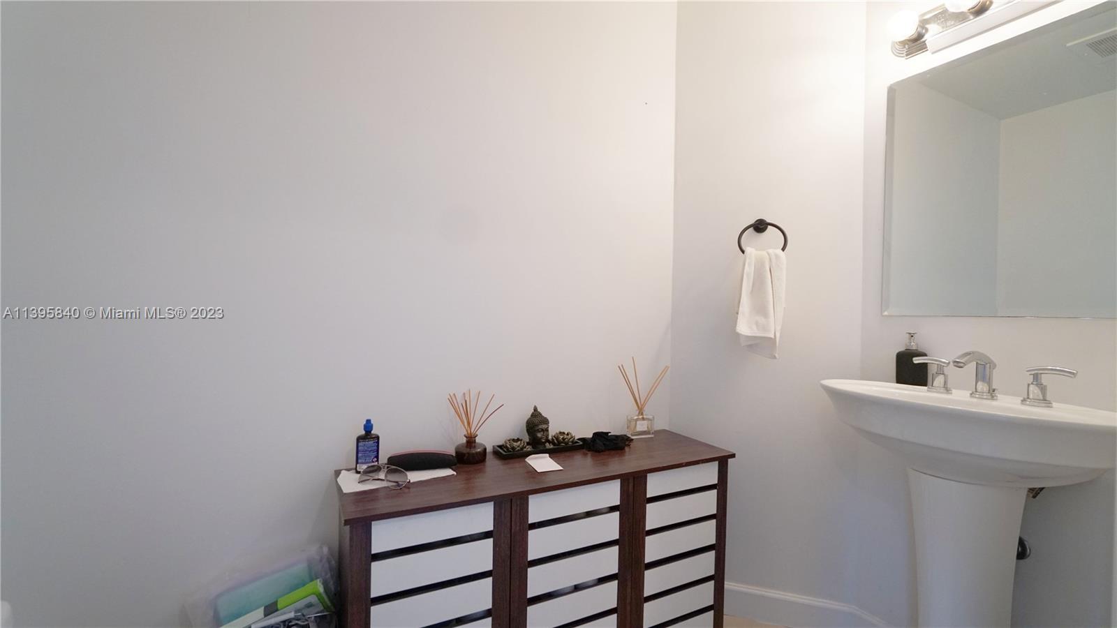Ocean Marine Yacht Club Hallandale Beach, FL 33009 - Photo 14 of 31 a bathroom with a sink and a mirror