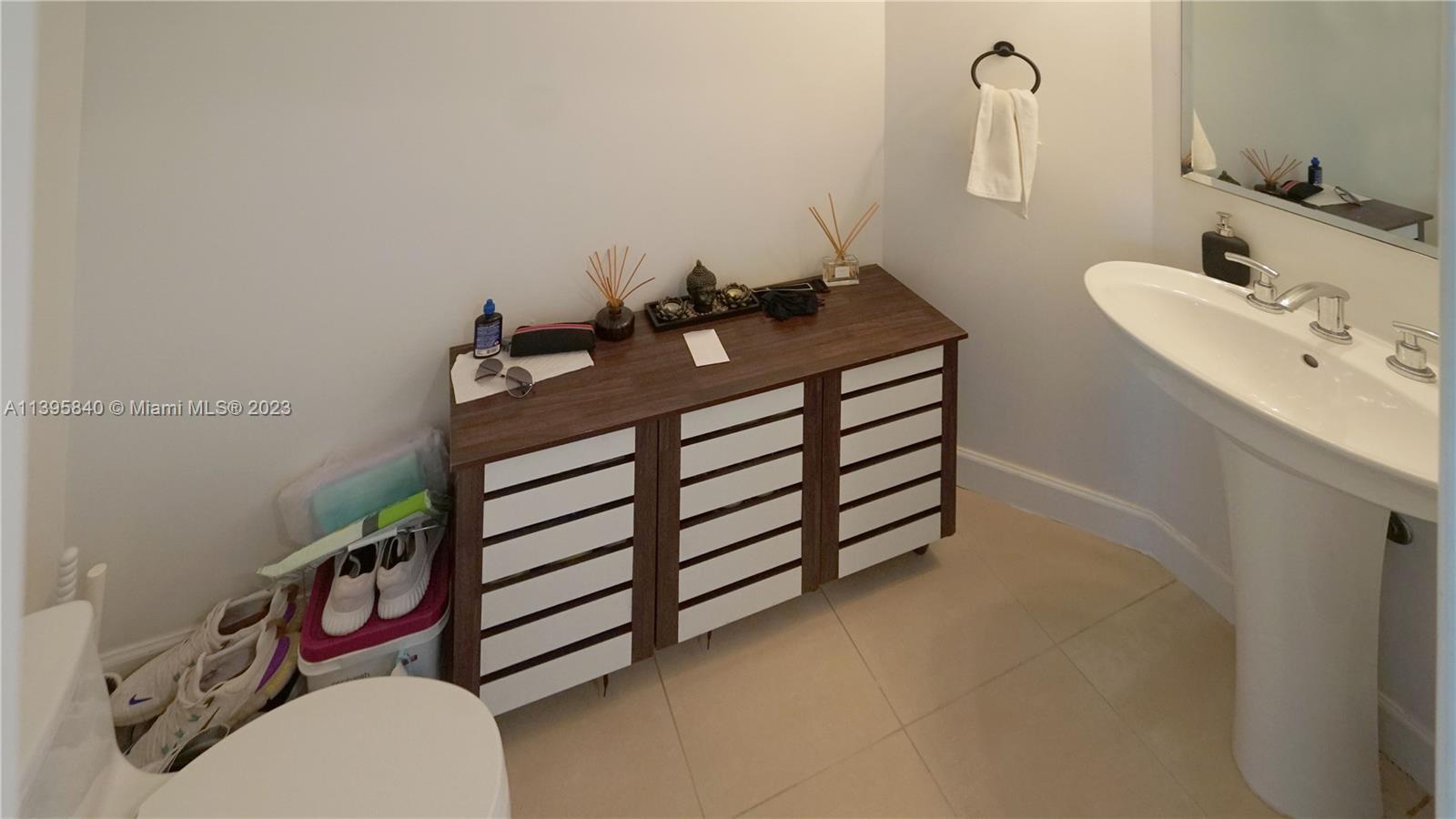 Ocean Marine Yacht Club Hallandale Beach, FL 33009 - Photo 15 of 31 a bathroom with a sink and a mirror