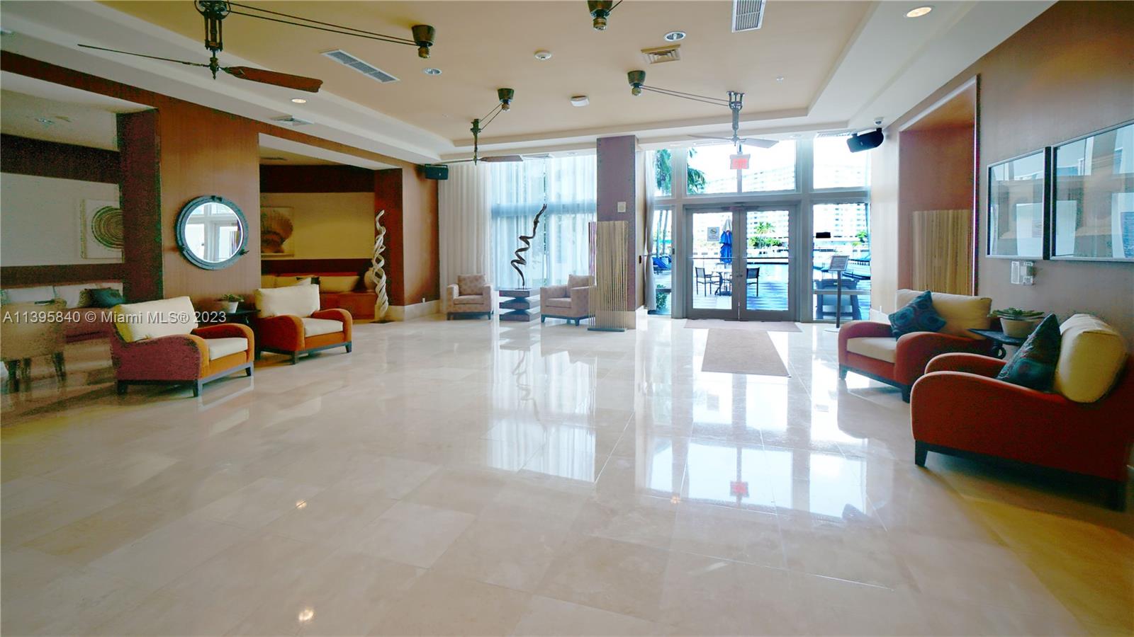 Ocean Marine Yacht Club Hallandale Beach, FL 33009 - Photo 18 of 31 a living room with furniture and a large window