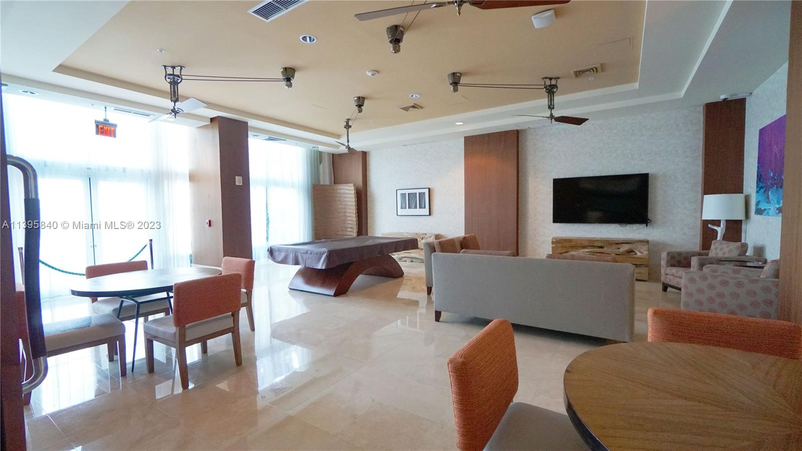 Ocean Marine Yacht Club Hallandale Beach, FL 33009 - Photo 19 of 31 a living room with furniture and a flat screen tv