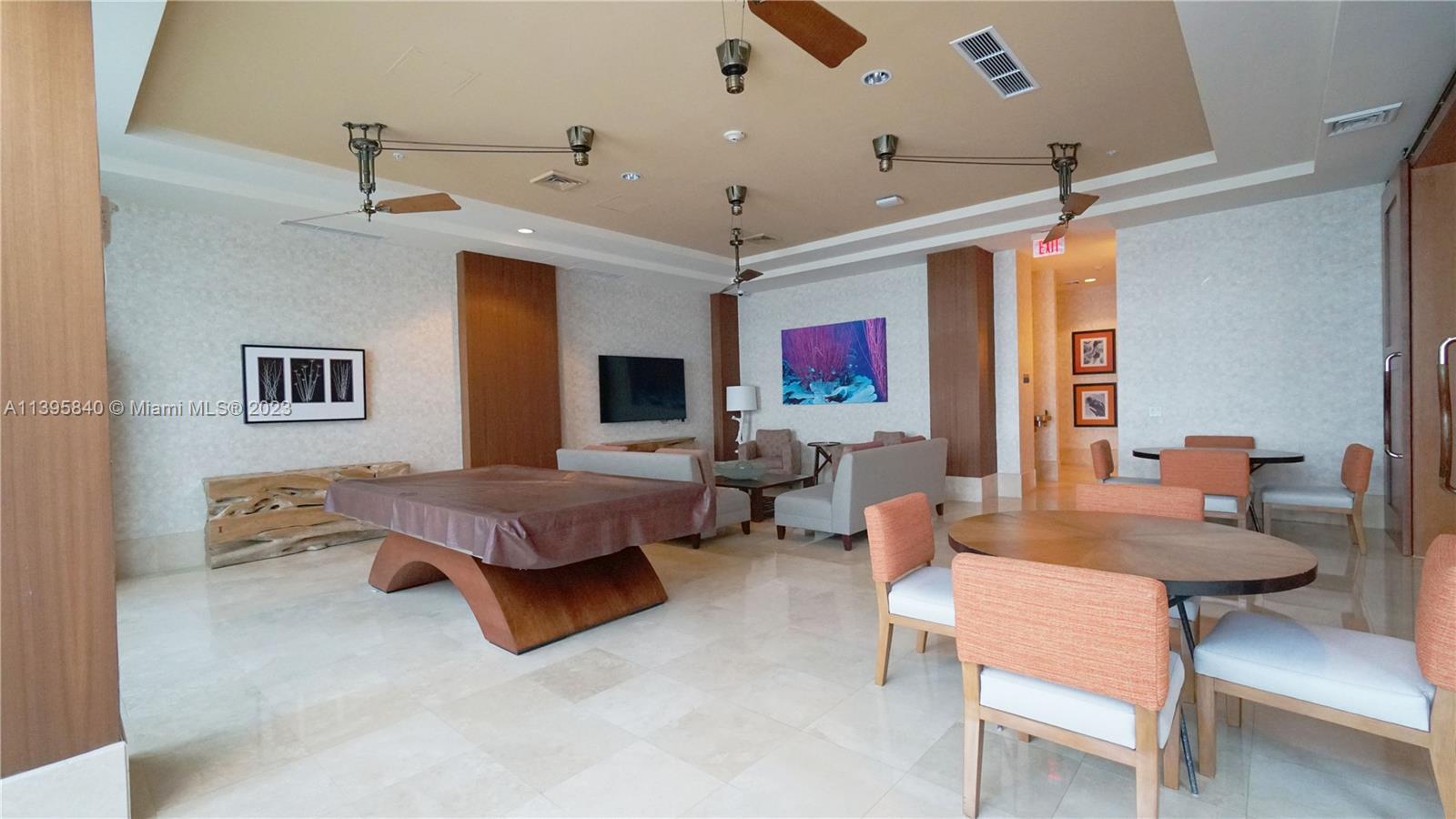 Ocean Marine Yacht Club Hallandale Beach, FL 33009 - Photo 20 of 31 a living room with furniture and a flat screen tv