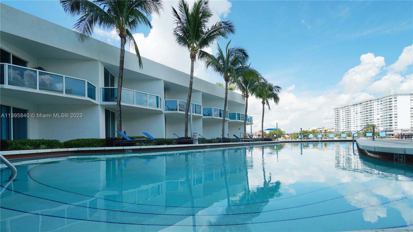 Ocean Marine Yacht Club Hallandale Beach, FL 33009 - Photo 22 of 31 a view of swimming pool with outdoor seating and plants