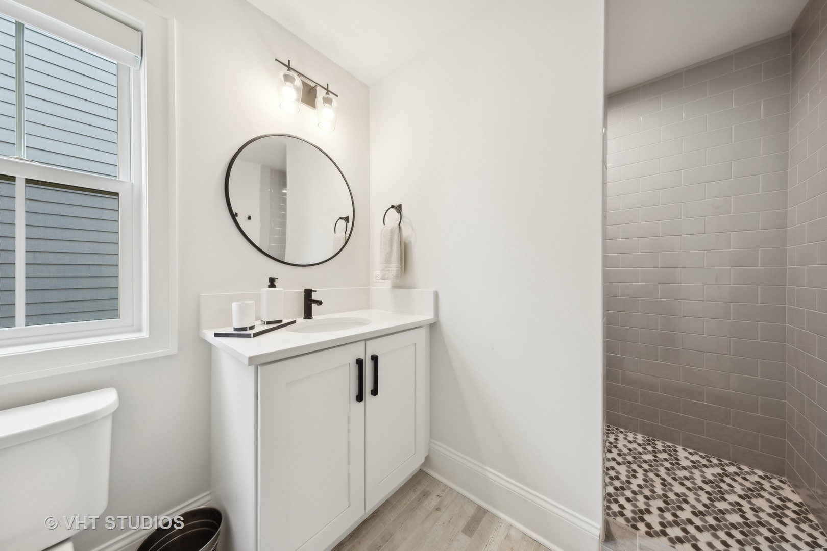 1110 Hickory Drive Western Springs, IL 60558 - Photo 40 of 55 a bathroom with a sink a toilet and a mirror