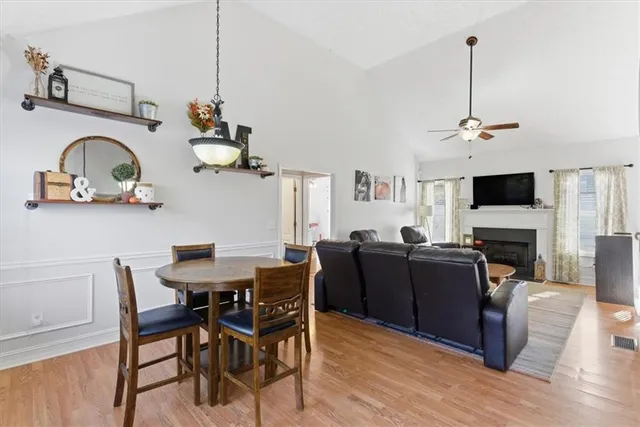 a view of a livingroom with furniture and a flat screen tv
