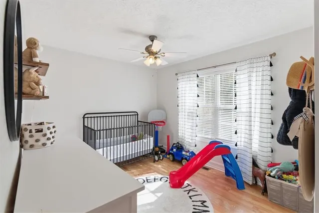 a bedroom with furniture and a chandelier