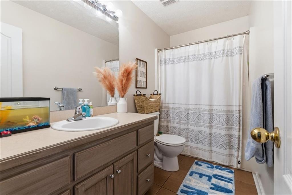 941 Grassdale Road Northwest Cartersville, GA 30121 - Photo 20 of 42 a bathroom with a sink toilet and shower