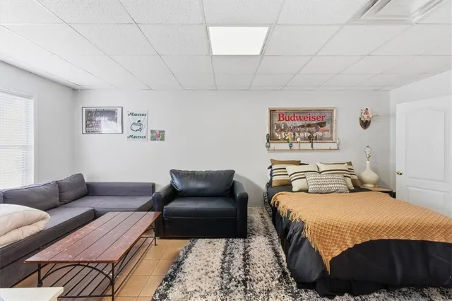 a bedroom with a bed and a couch