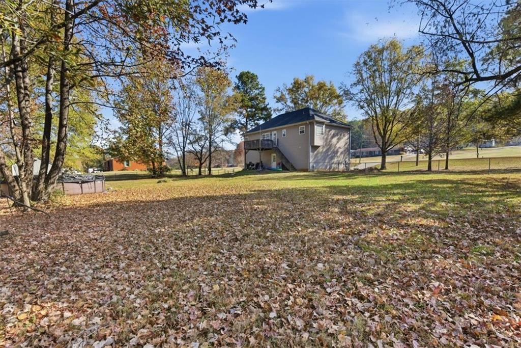 941 Grassdale Road Northwest Cartersville, GA 30121 - Photo 7 of 42 a view of a big yard with large trees