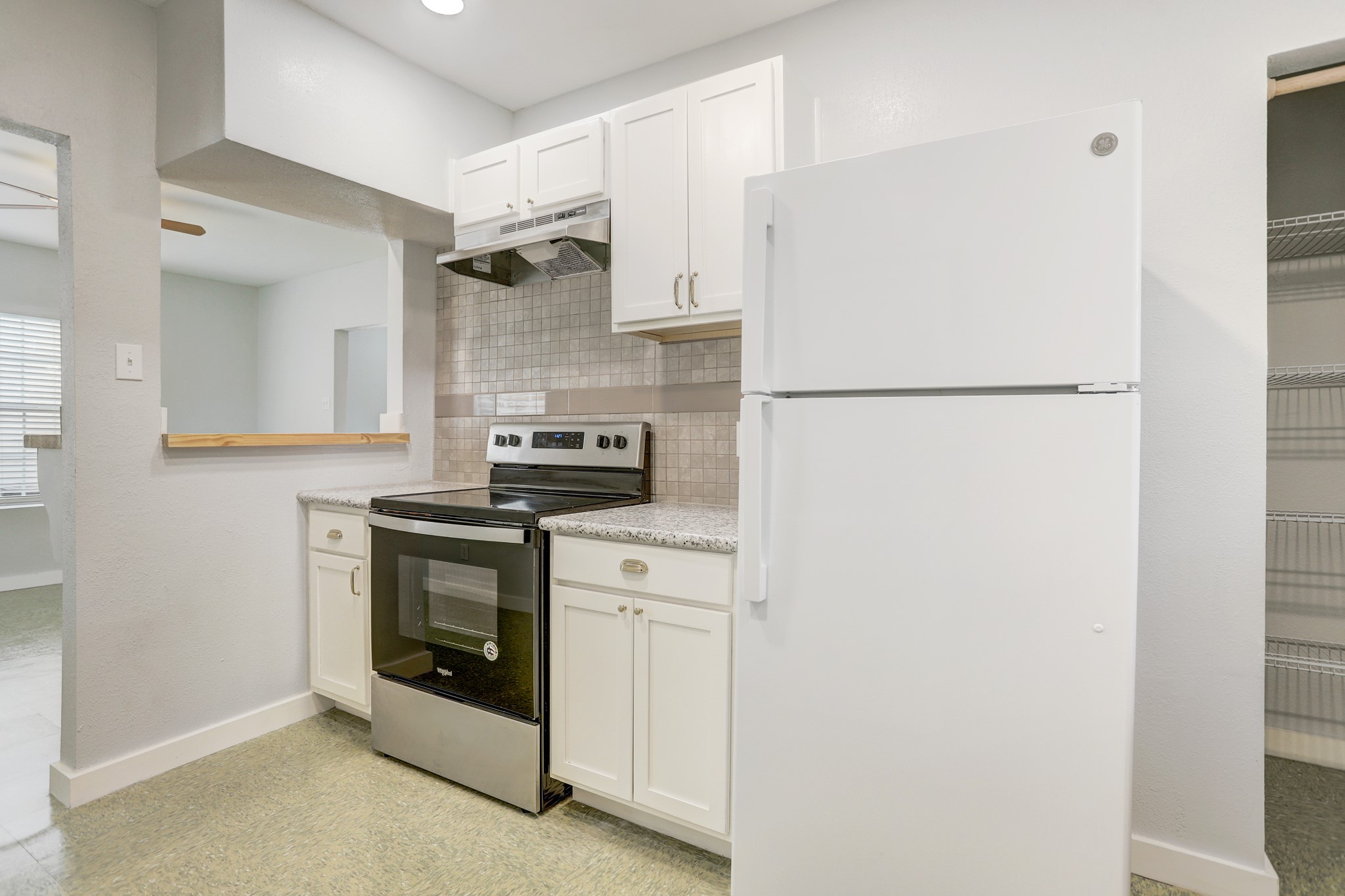 3345 Reeves Street, Unit A Houston, TX 77004 - Photo 2 of 9 a white refrigerator freezer and a stove sitting inside of a kitchen