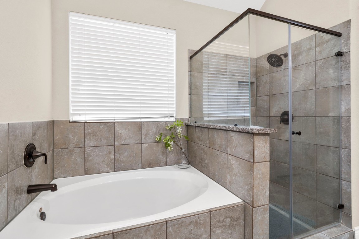 4926 Magnolia Bend Drive Rosharon, TX 77583 - Photo 19 of 27 a bathroom with a bath tub and shower