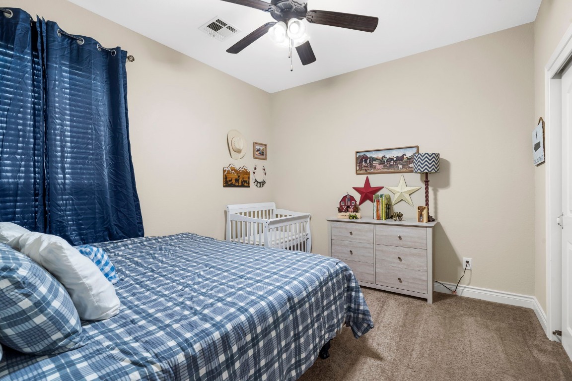 4926 Magnolia Bend Drive Rosharon, TX 77583 - Photo 20 of 27 a bedroom with a bed and a cabinets