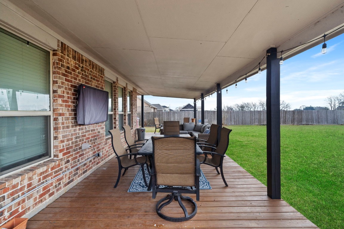 4926 Magnolia Bend Drive Rosharon, TX 77583 - Photo 25 of 27 a view of a patio with chairs and wooden floor