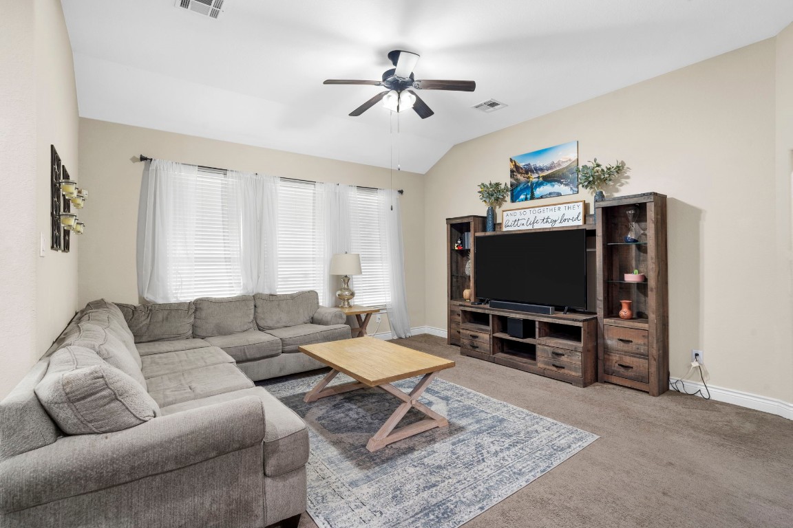 4926 Magnolia Bend Drive Rosharon, TX 77583 - Photo 6 of 27 a living room with furniture and a flat screen tv