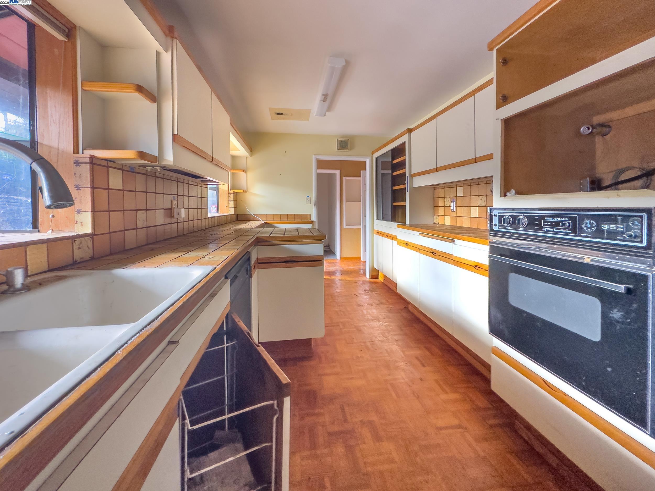 1770 Pleasant Hill Road Pleasant Hill, CA 94523 - Photo 16 of 17 a kitchen with stainless steel appliances granite countertop a stove and a sink