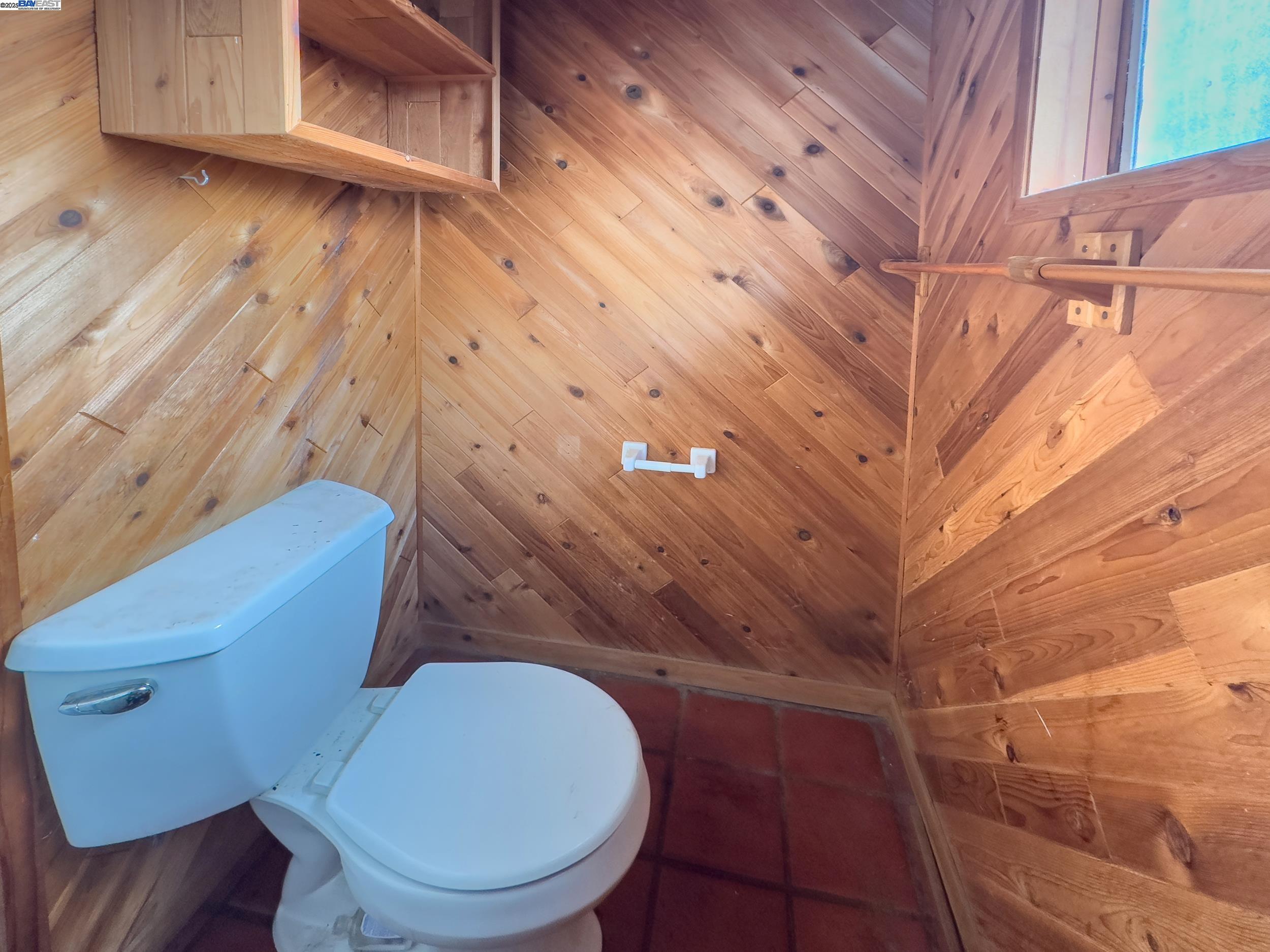 1770 Pleasant Hill Road Pleasant Hill, CA 94523 - Photo 18 of 23 a toilet sitting in a bathroom next to a wooden cabinet