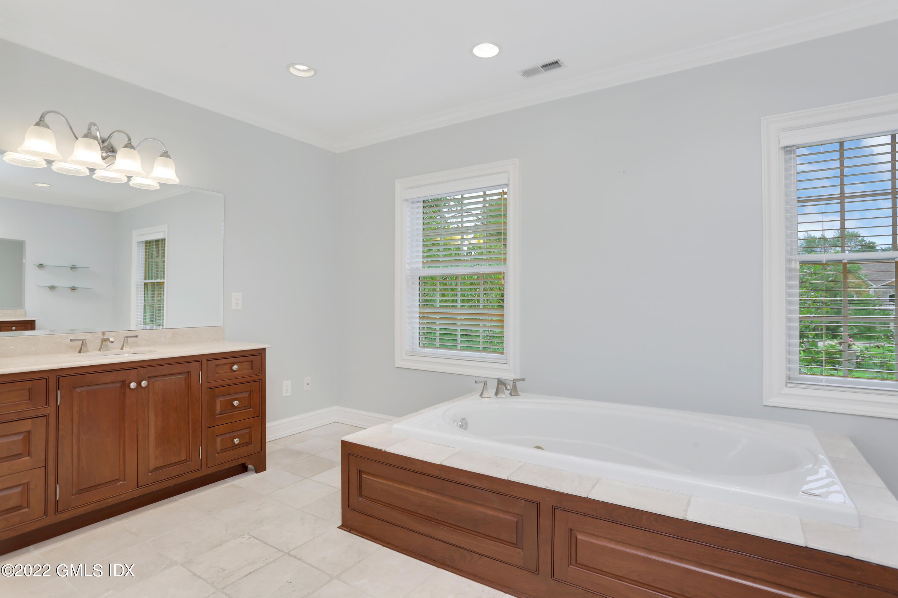 19 West Hill Road Stamford, CT 06902 - Photo 16 of 25 a bathroom with a tub sink and mirror