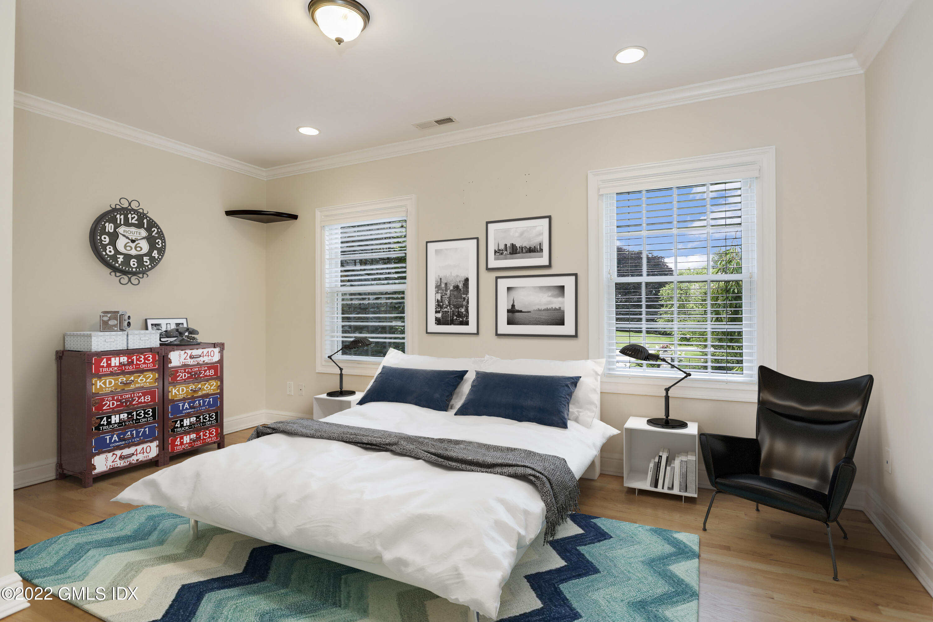 19 West Hill Road Stamford, CT 06902 - Photo 20 of 25 a bedroom with a bed and wooden floor