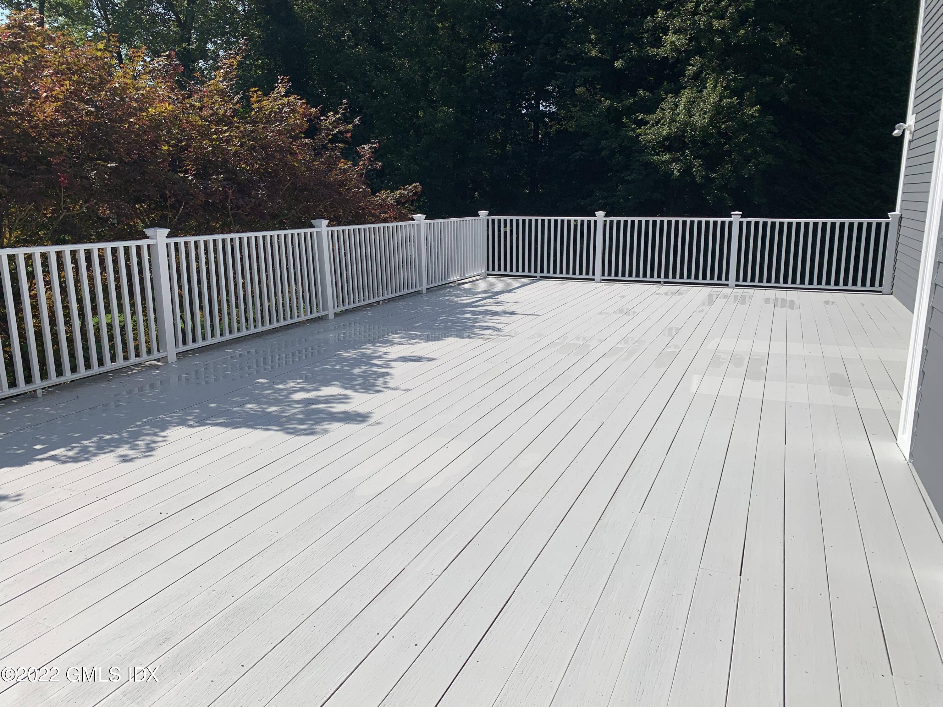 19 West Hill Road Stamford, CT 06902 - Photo 21 of 25 a balcony with wooden floor