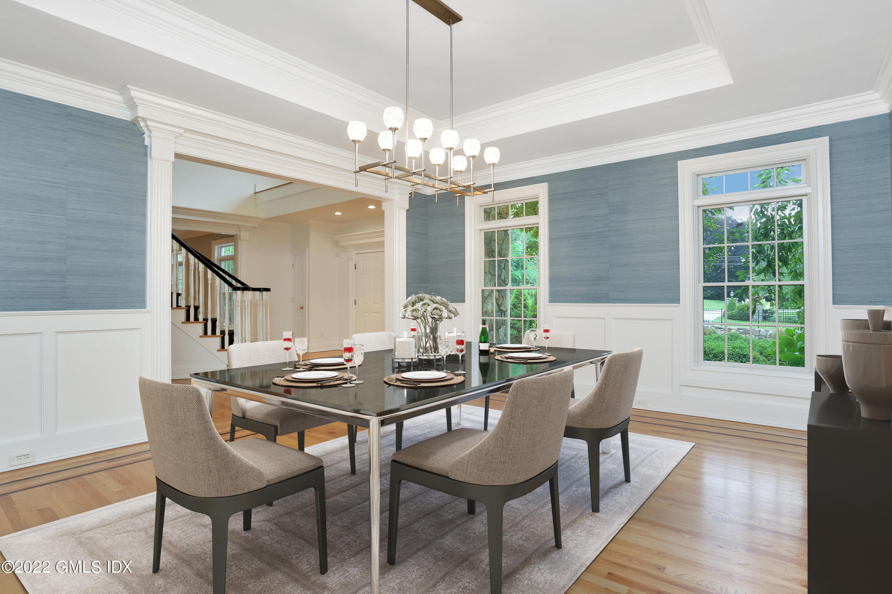 19 West Hill Road Stamford, CT 06902 - Photo 5 of 25 a dining room with furniture a chandelier and wooden floor