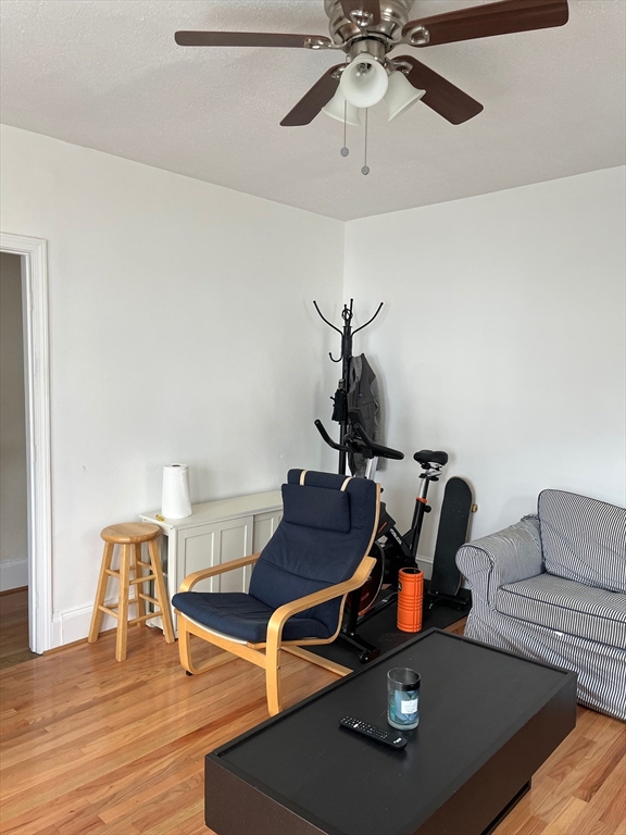 34 Clark Street, Unit 1 Somerville, MA 02143 - Photo 8 of 9 a living room with furniture and air hockey table