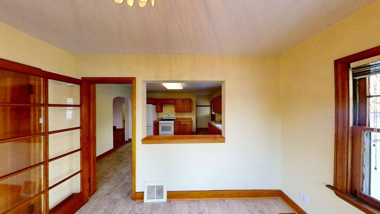 509 West Williams Street Kankakee, IL 60901 - Photo 13 of 26 a hallway with a large window and potted plants