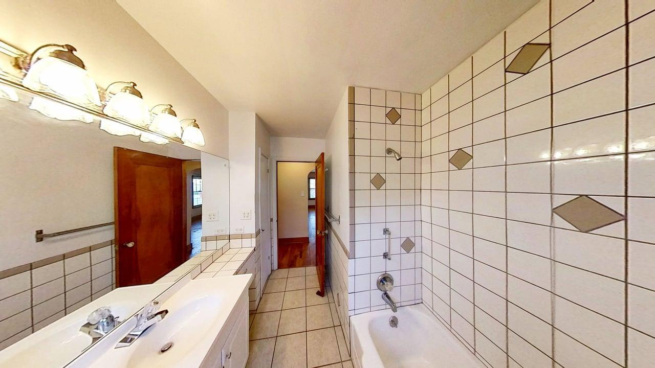 509 West Williams Street Kankakee, IL 60901 - Photo 15 of 26 a bathroom with a bathtub and shower