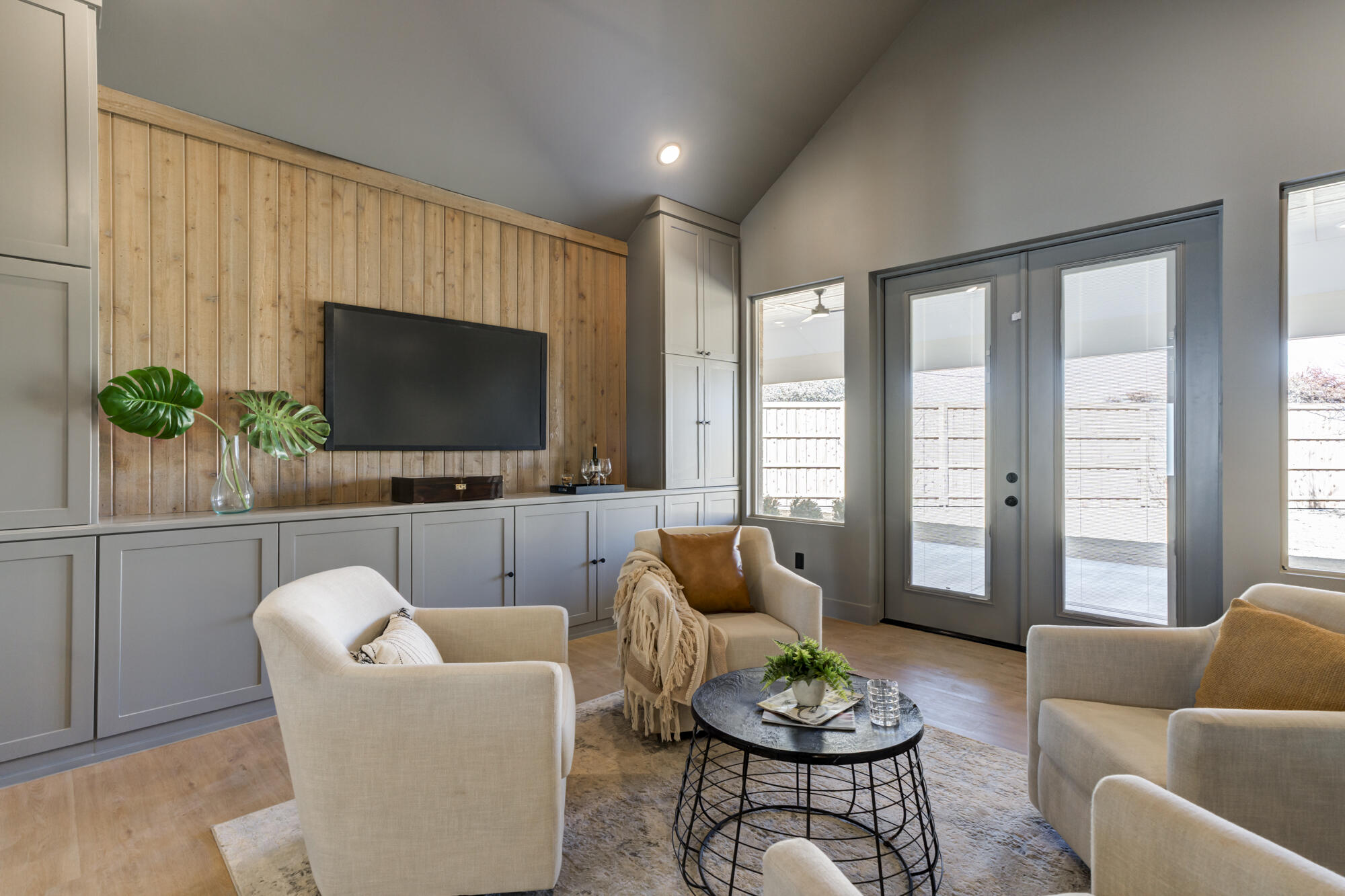 4312 136th Street Lubbock, TX 79423 - Photo 2 of 7 a living room with furniture a flat screen tv and a large window
