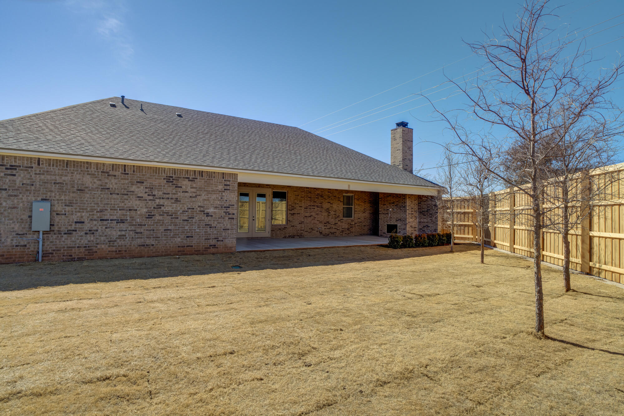 4312 136th Street Lubbock, TX 79423 - Photo 6 of 7 a front view of a house with a yard