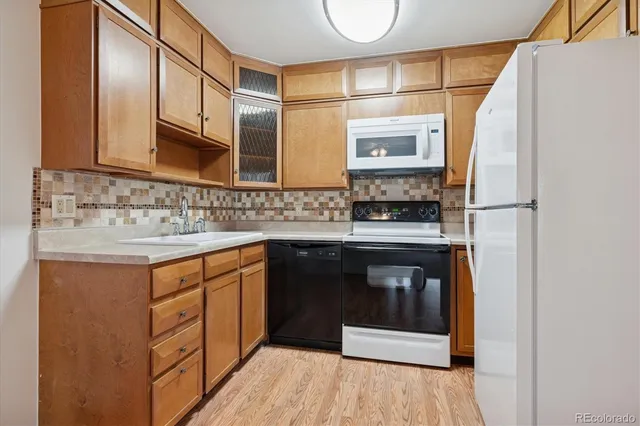 a kitchen with stainless steel appliances granite countertop a stove and a sink