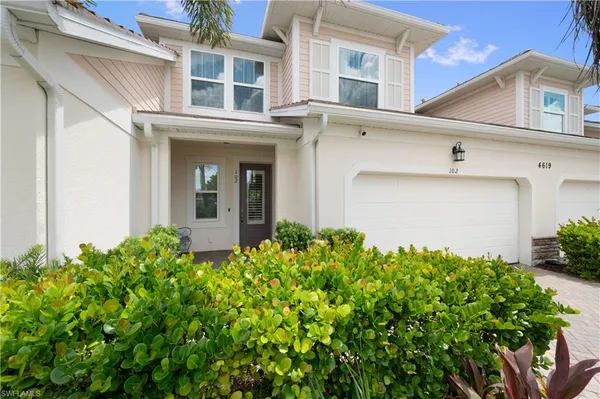 front view of a house with a small yard
