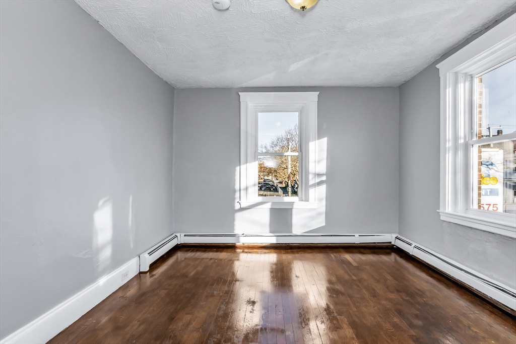 88 Congress Street, Unit 3 Salem, MA 01970 - Photo 20 of 31 an empty room with wooden floor and windows