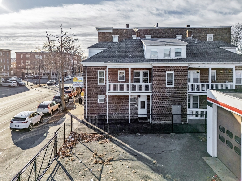 88 Congress Street, Unit 3 Salem, MA 01970 - Photo 26 of 31 a view of a brick house with many windows