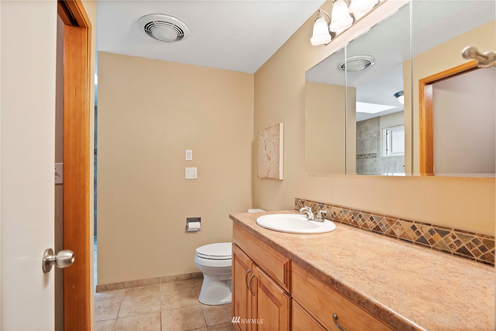 22224 3rd Avenue Southeast Bothell, WA 98021 - Photo 13 of 30 a bathroom with a granite countertop sink toilet and shower