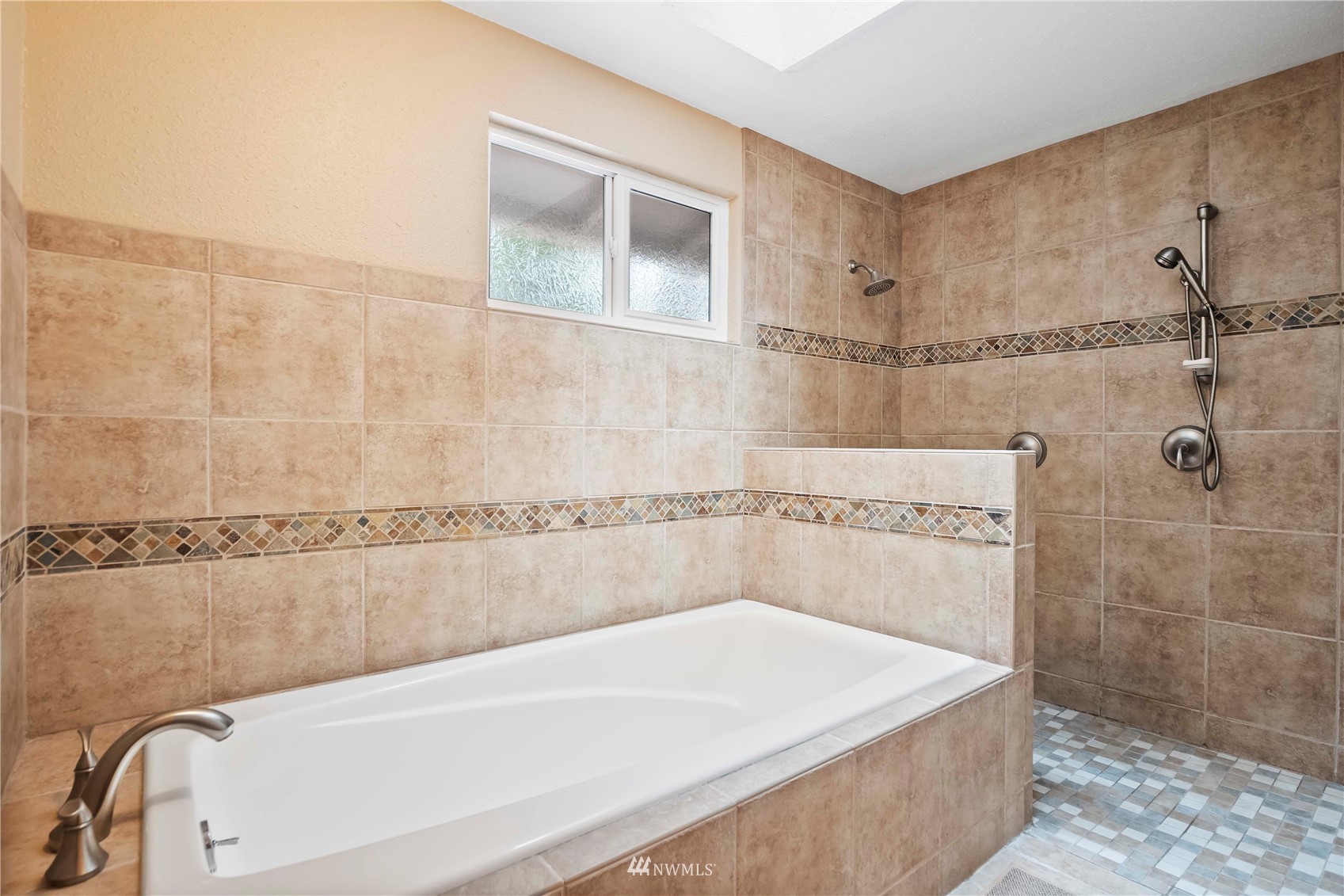 22224 3rd Avenue Southeast Bothell, WA 98021 - Photo 14 of 30 a bathroom with a tub a sink and a shower