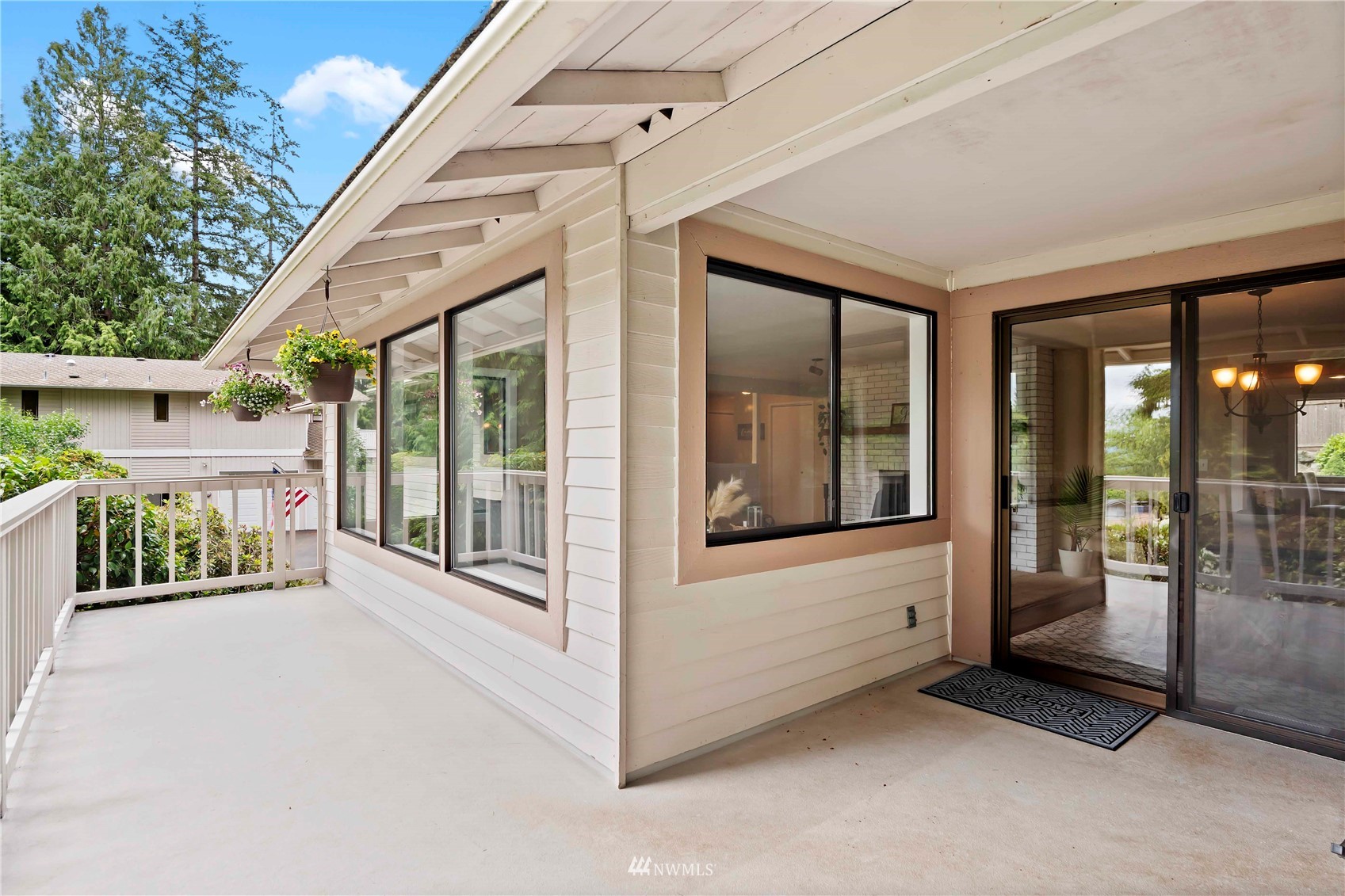 22224 3rd Avenue Southeast Bothell, WA 98021 - Photo 21 of 30 a view of a porch with a floor to ceiling window and an outdoor kitchen