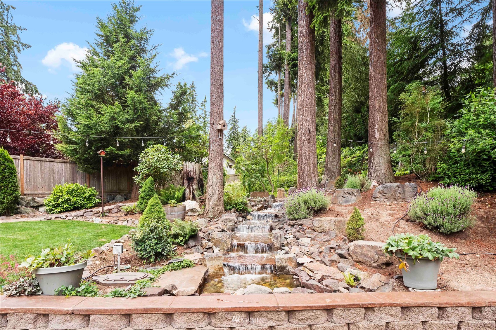 22224 3rd Avenue Southeast Bothell, WA 98021 - Photo 26 of 30 a view of a garden with a fountain