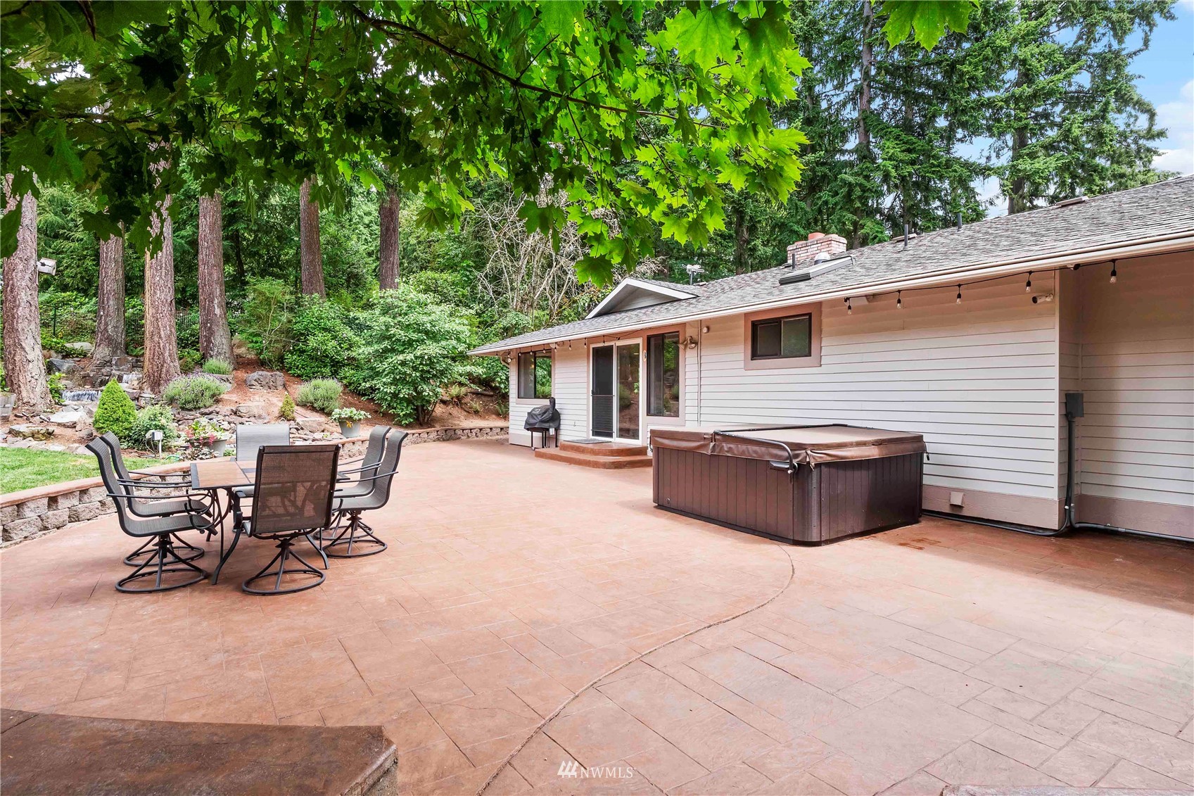 22224 3rd Avenue Southeast Bothell, WA 98021 - Photo 28 of 30 a view of a patio with table and chairs and potted plants